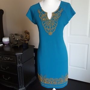 Teal color dress with gold accents